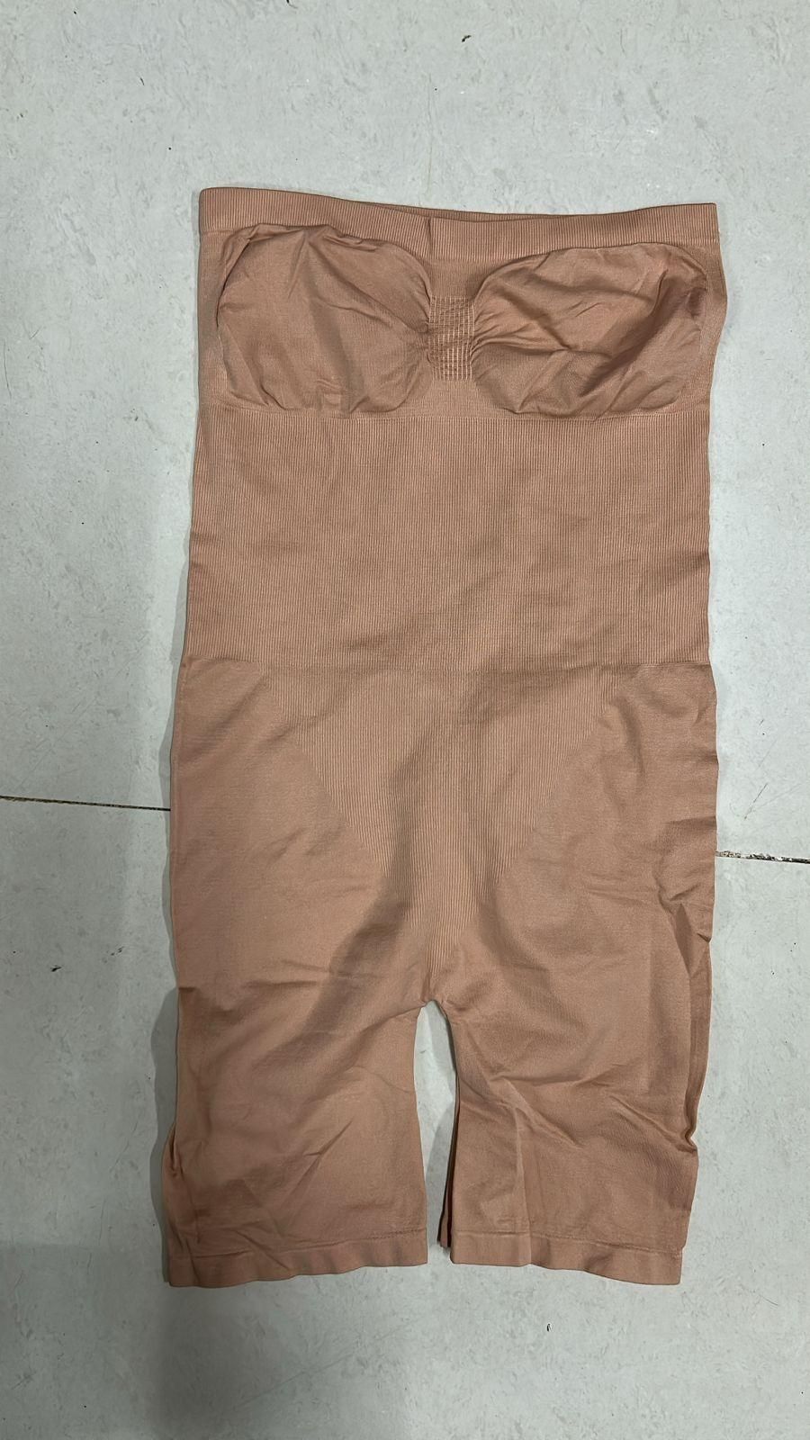 Brown pants on a light gray surface