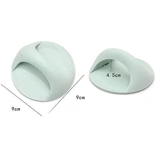Two light green silicone door stoppers with measurements on a white background