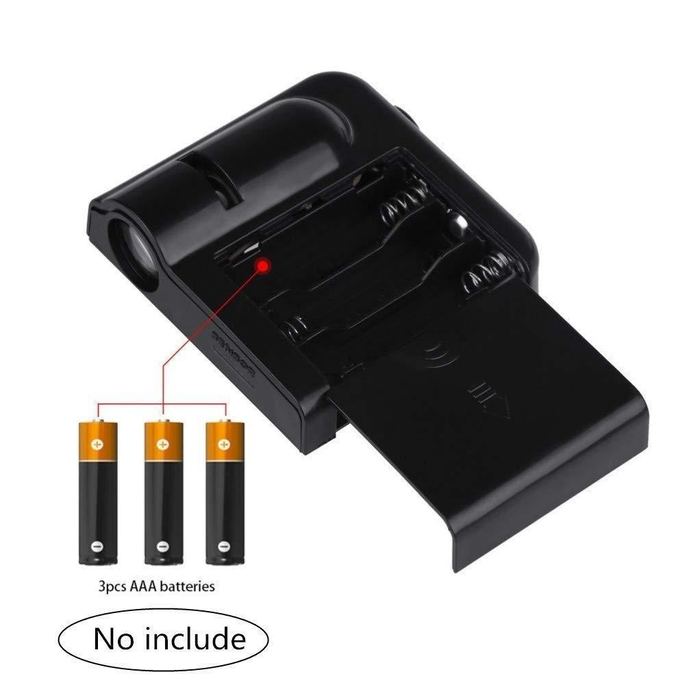 Black battery charger with three AAA batteries on a white background