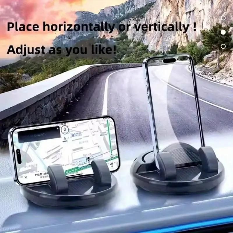 Two phone holders on a car dashboard with a scenic road in the background