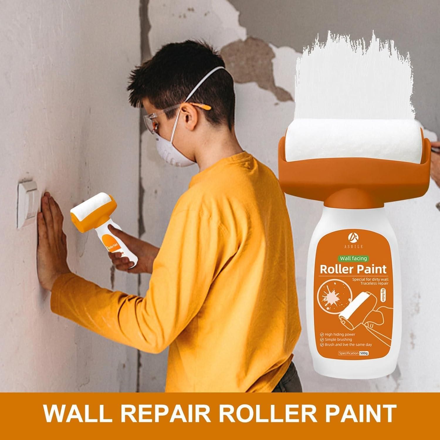 Person applying wall repair roller paint with a roller and a bottle of roller paint in the foreground.