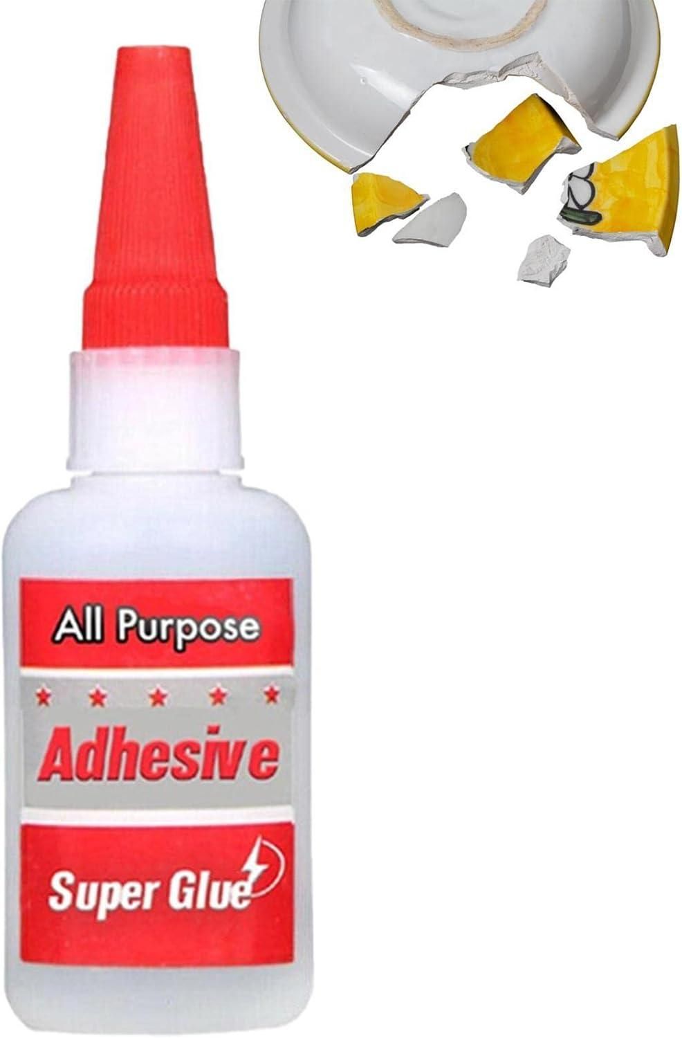 Bottle of all-purpose adhesive with a broken ceramic item and pieces on a white background