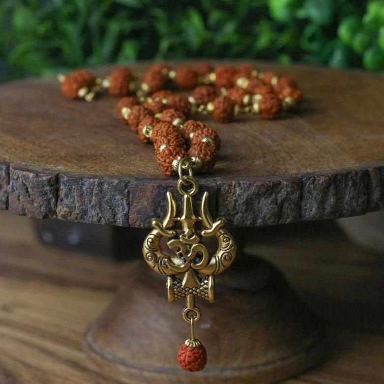 Panchmukhi Rudraksha Trishool Mala – OM + Shiva Energy (1 Pc) Bold devotion. Rooted power. A sacred drop for modern men.