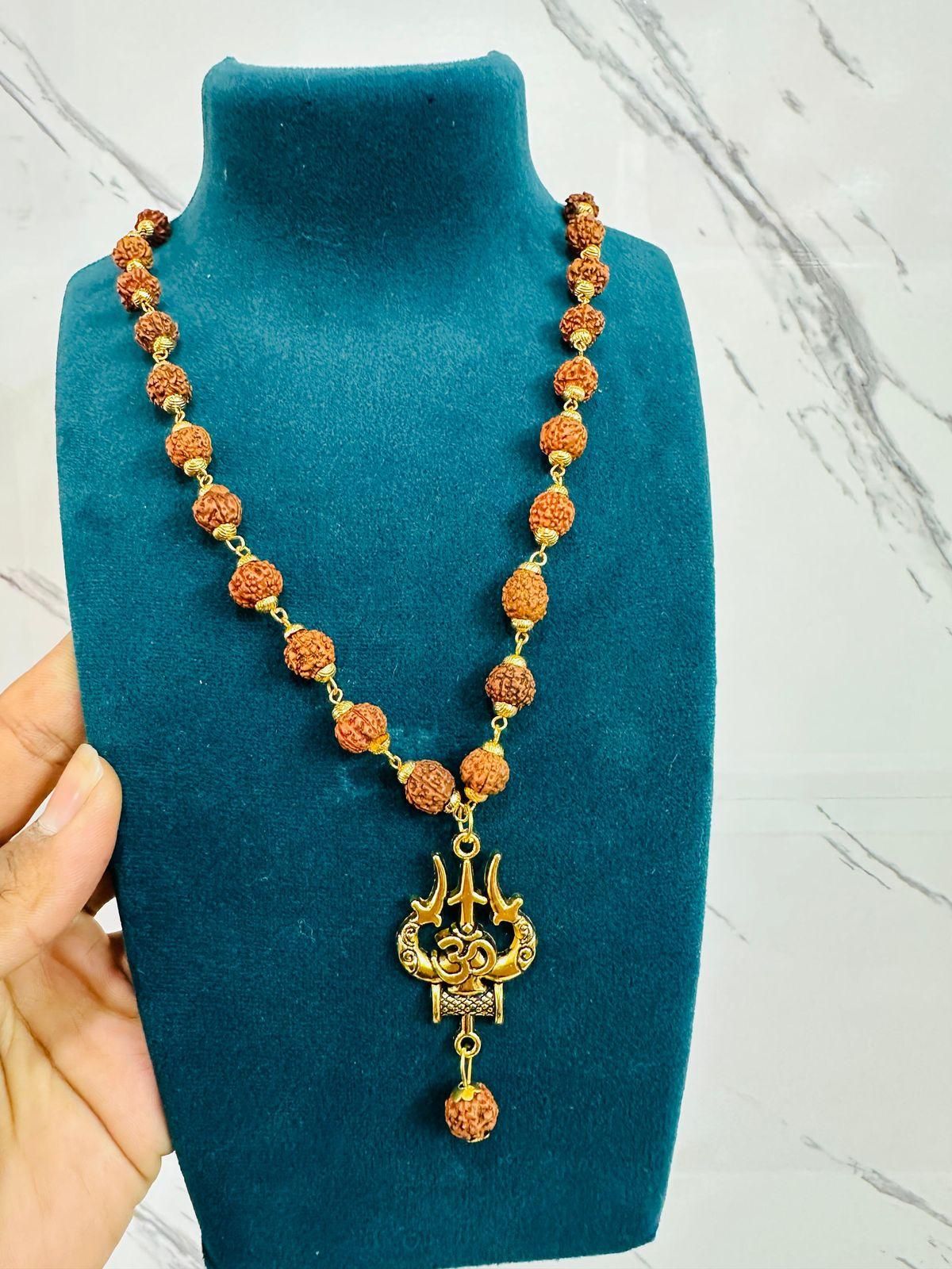 Panchmukhi Rudraksha Trishool Mala – OM + Shiva Energy (1 Pc) Bold devotion. Rooted power. A sacred drop for modern men.