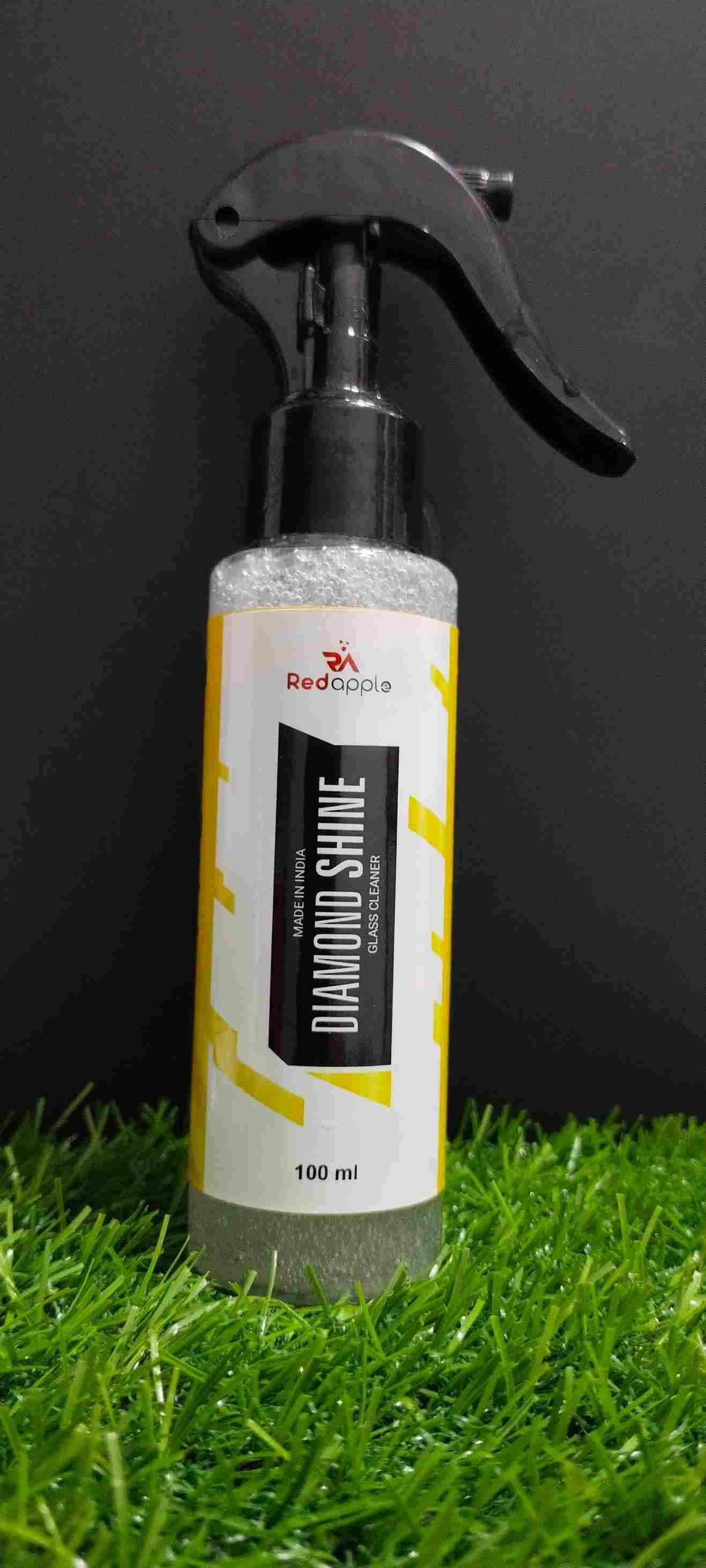 Bottle of Redchase Diamond Shine on grass with a black background